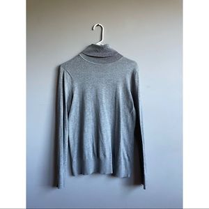 Grey turtle neck.